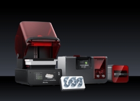 Dentist using intraoral camera on patient